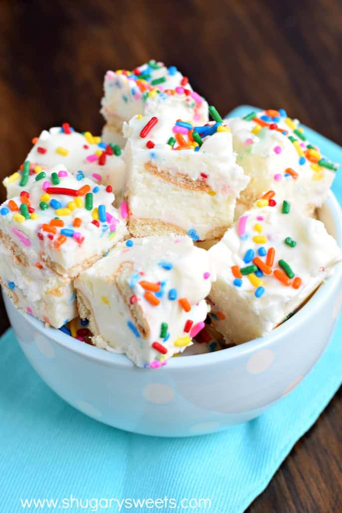 Blue bowl with pieces of birthday cake fudge with sprinkles.