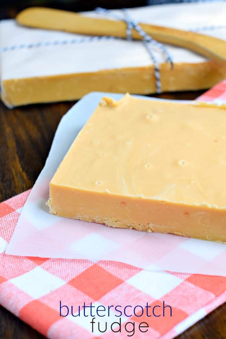 Block of butterscotch fudge on parchment paper.