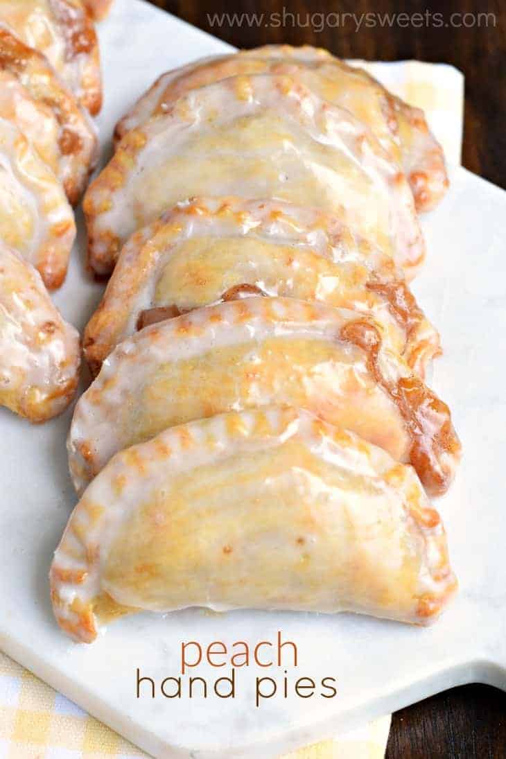 White platter with peach hand pies.