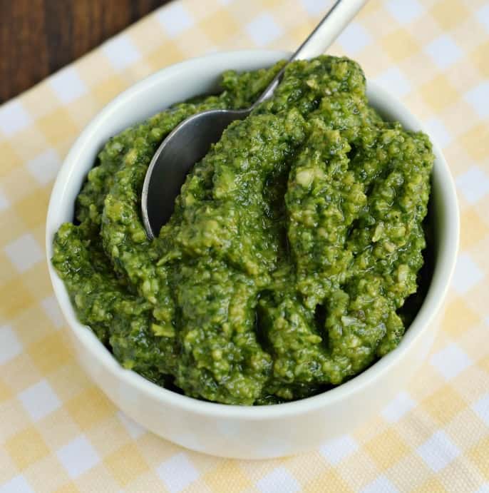 This quick and easy Basil Pesto is so delicious, you'll need to make a second batch! Perfect for adding to pasta, fish, baked tomatoes and sandwiches, it's kicks up the flavor of your favorite foods!