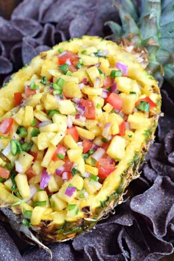 Hollowed out pineapple with fresh homemade salsa put into the fruit. Served with blue corn chips