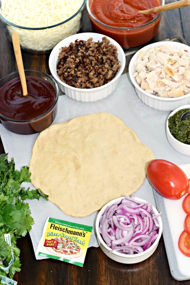Ingredients needed to make homemade grilled pizzas with homemade pizza dough.