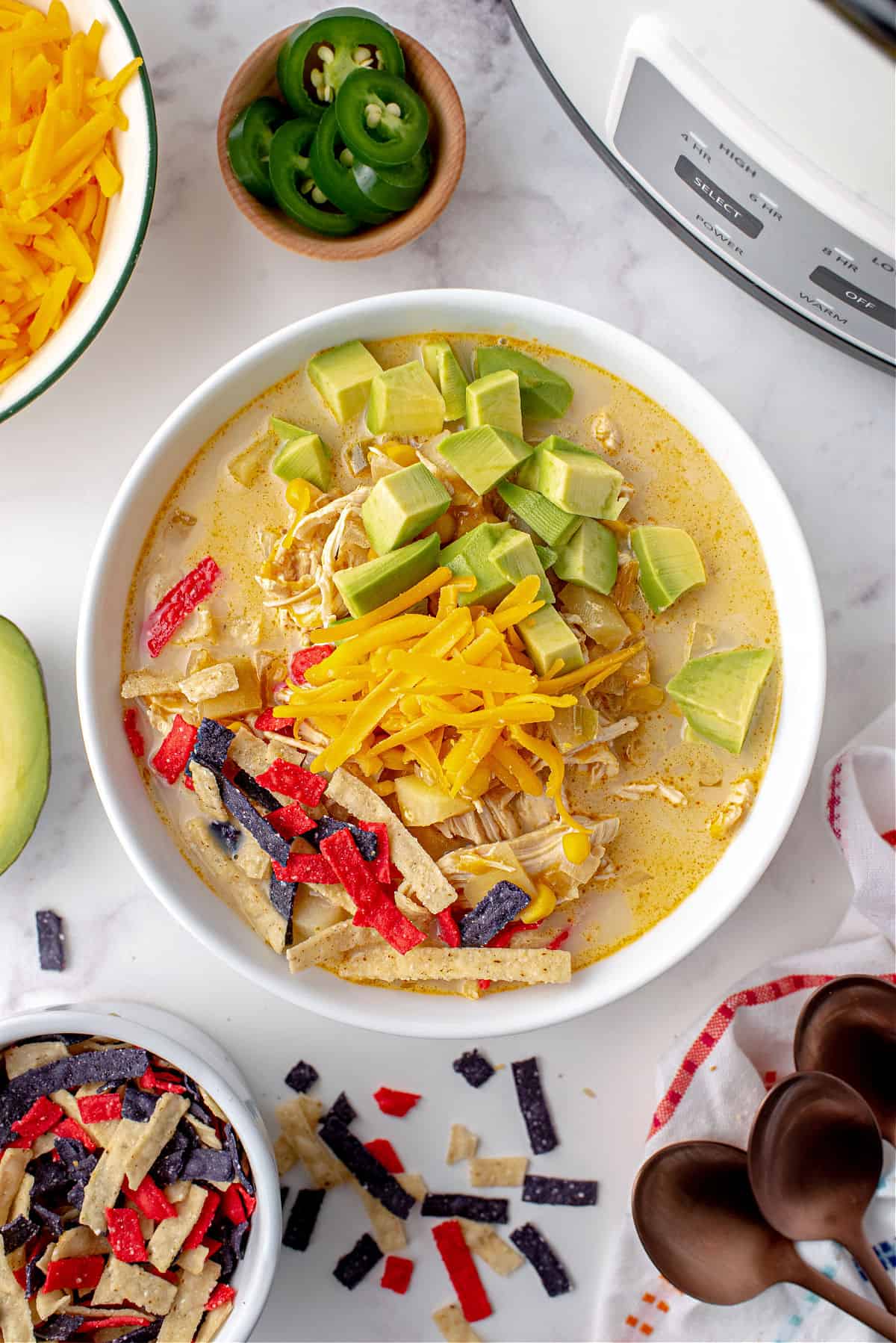 Chicken chowder with cheese, avocado, and tortilla strips!