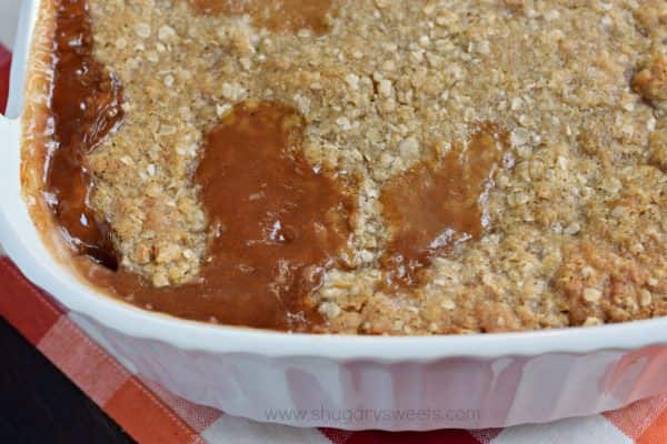 Don't tell anyone, but this hot Zucchini Crumble recipe is like apple pie, but with veggies! Sweet, caramel zucchini with a crunchy cinnamon crumble on top, this is the perfect comfort food dessert!