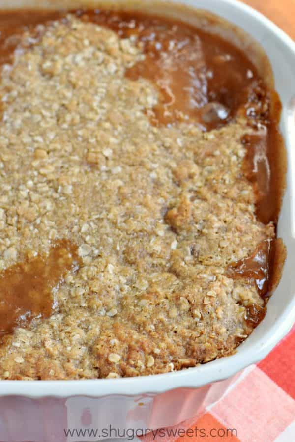 Don't tell anyone, but this hot Zucchini Crumble recipe is like apple pie, but with veggies! Sweet, caramel zucchini with a crunchy cinnamon crumble on top, this is the perfect comfort food dessert!
