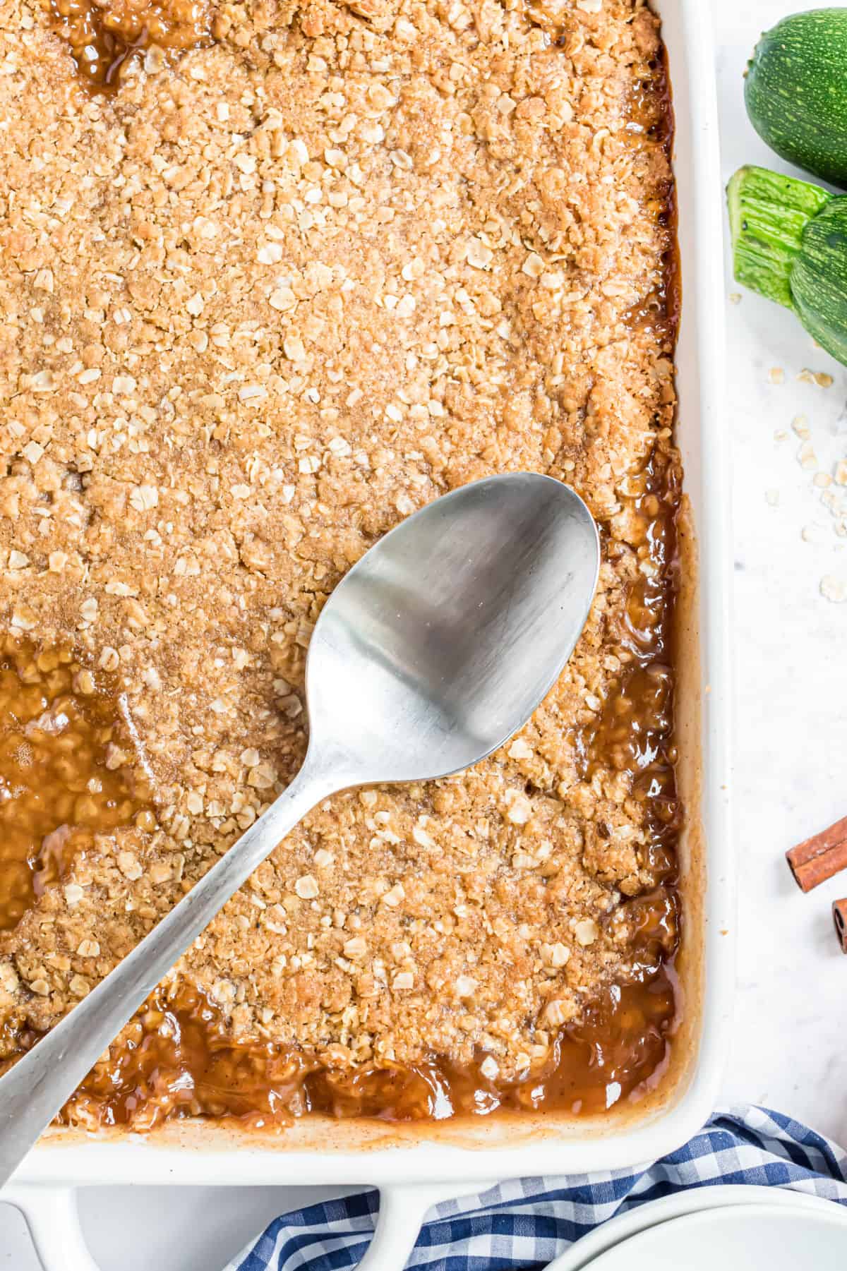 Zucchini crumble baked in a white 13x9 dish.