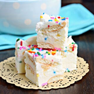Three pieces of vanilla fudge with sprinkles on a cream colored doily.