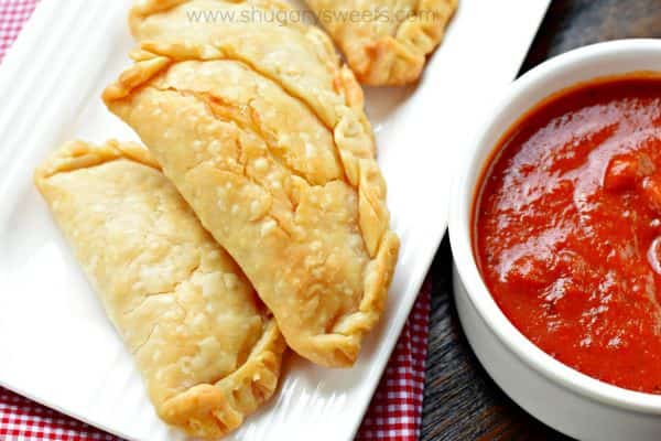 Flaky pie crust filled with pepperoni and cheese. These baked Pepperoni Pizza Hand Pies are ready in minutes and make a great meal!