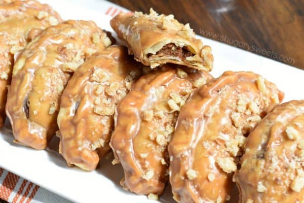 These Pumpkin Hand Pies are the perfect fall treat! The flaky crust and nutty pumpkin pie filling are the perfect combo in a hand pie, plus they’ve got a wonderful maple walnut glaze!