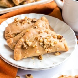 These Pumpkin Hand Pies are the perfect fall treat! The flaky crust and nutty pumpkin pie filling are the perfect combo in a hand pie, plus they’ve got a wonderful maple walnut glaze!