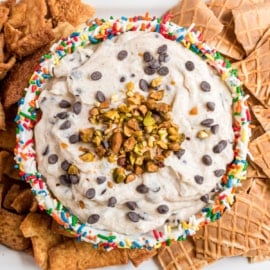 This easy, sweet Cannoli Dip recipe tastes like the delicious filling of your favorite Italian dessert! Add fresh pistachios and sprinkles for a festive flair.