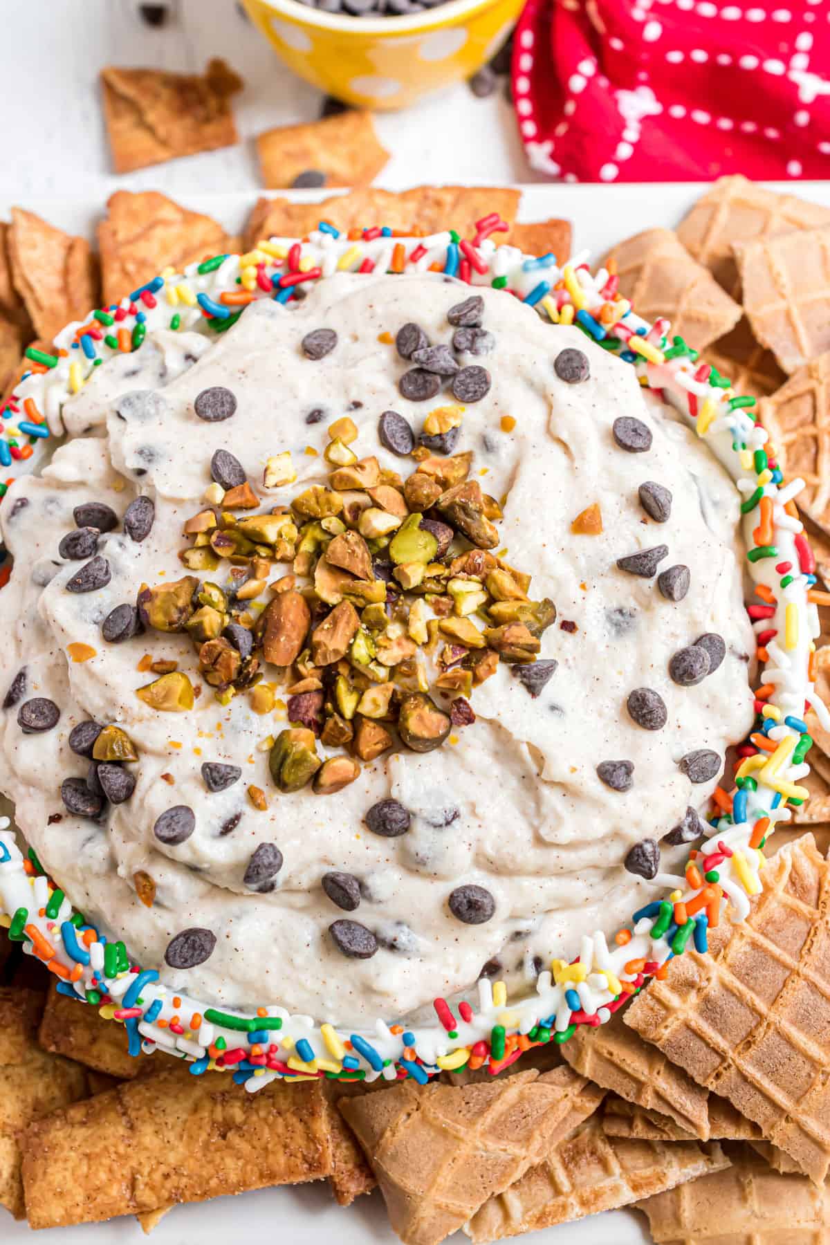 Cannoli dip in a bowl with waffle cone pieces to dip.