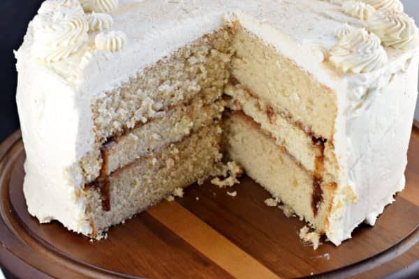 If you're looking for a delicious dessert, give this Cinnamon Roll Cheesecake Cake a try! Layers of homemade cinnamon cake and cinnamon cheesecake topped with a sweet, cinnamon frosting!