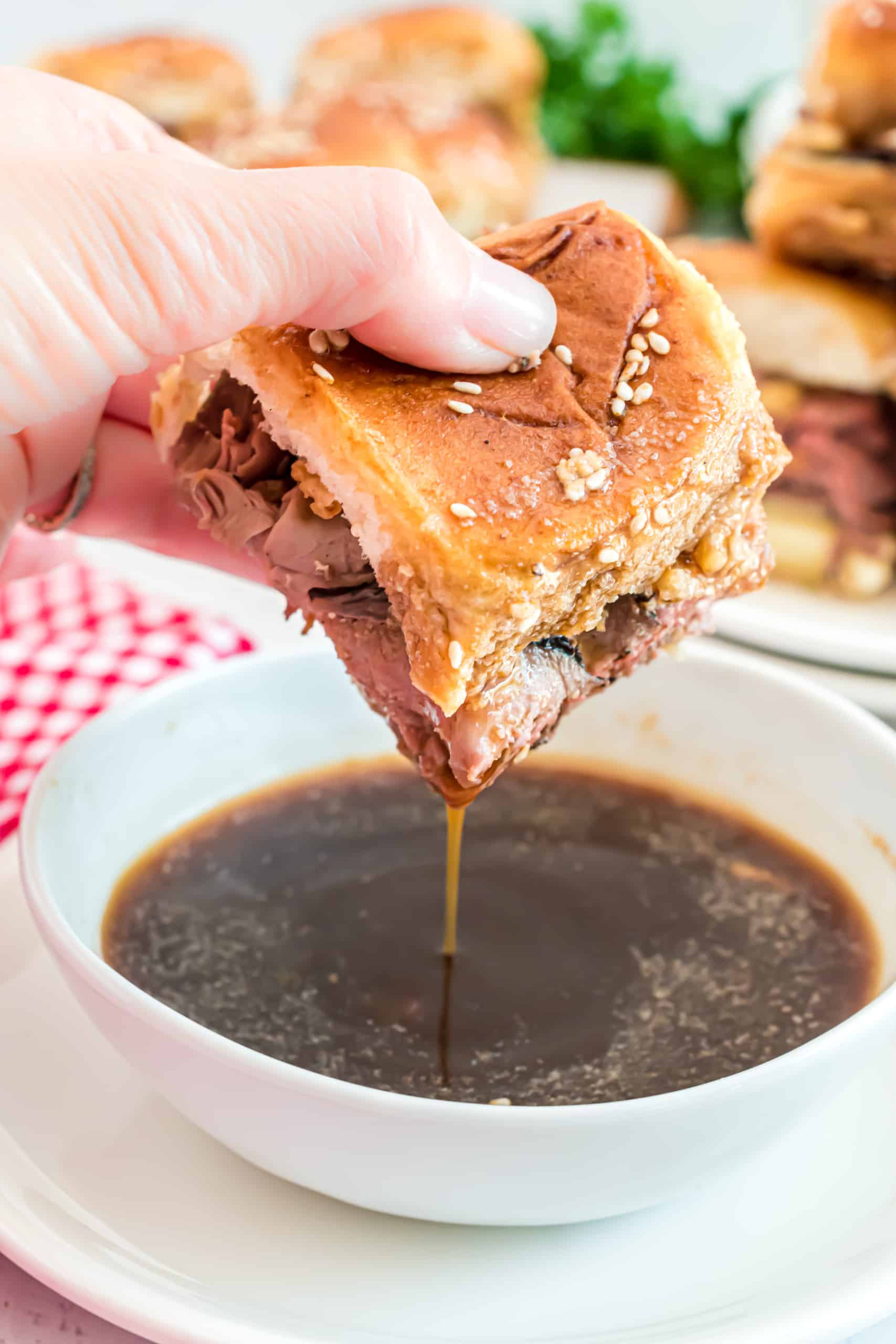 French dip sliders dipped in au jus.