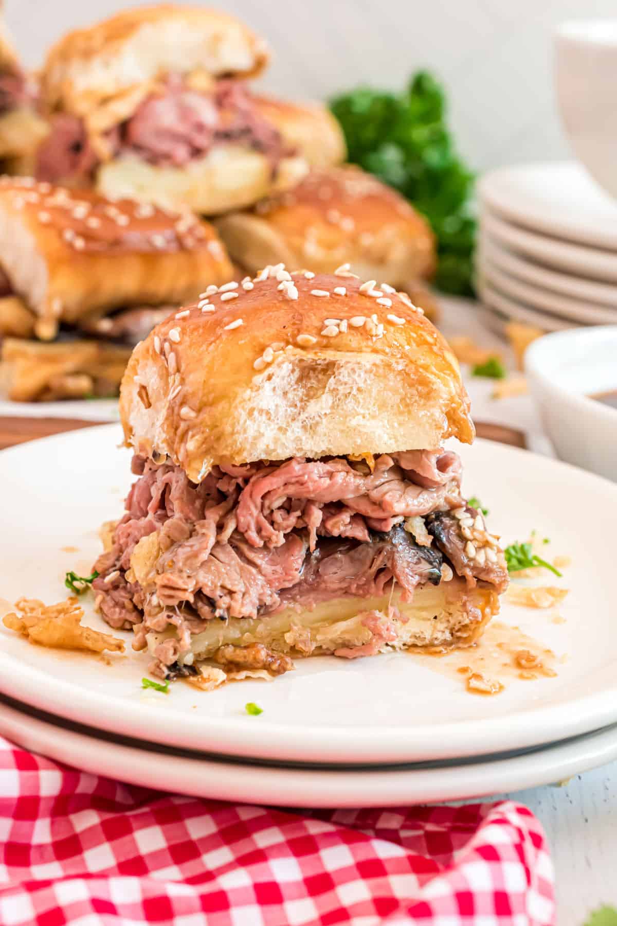 French dip slider served on a white plate.