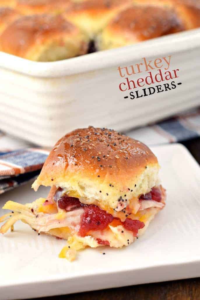 Leftover turkey on sliders with cranberry and cheese.