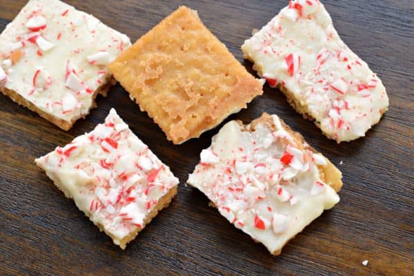 This Peppermint Cracker Toffee is ridiculously easy and delicious. Crisp, buttery toffee topped with white chocolate and peppermint candy!