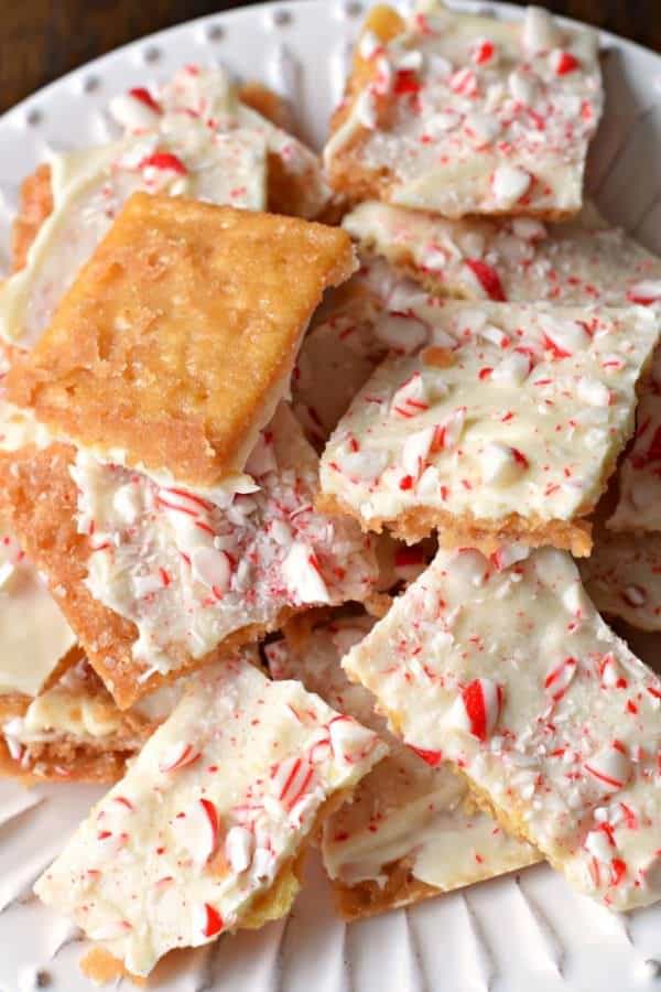 This Peppermint Cracker Toffee is ridiculously easy and delicious. Crisp, buttery toffee topped with white chocolate and peppermint candy!