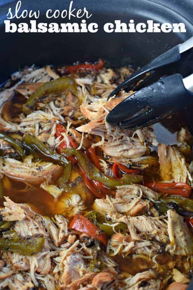 Shredded chicken and peppers in a crockpot with balsamic sauce.