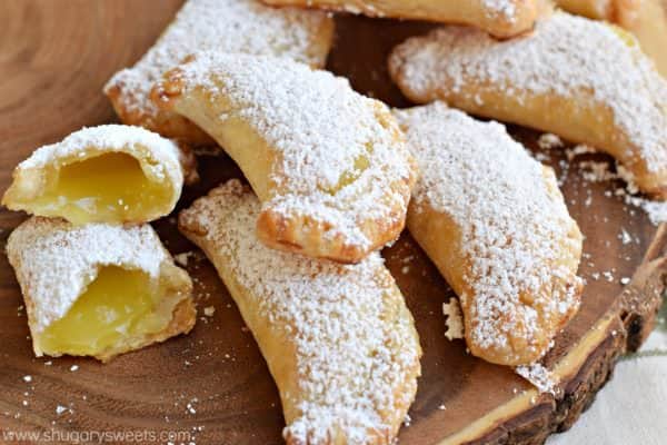 Lemon Hand Pies: flaky, baked hand pies with a sweet lemon filling! Don't forget the dusting of powdered sugar on top!