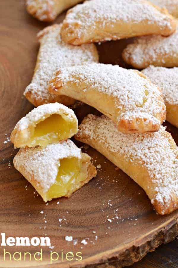 Lemon Hand Pies: flaky, baked hand pies with a sweet lemon filling! Don't forget the dusting of powdered sugar on top!