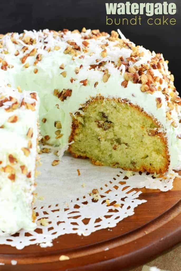 Watergate bundt cake on a doily topped cake platter.