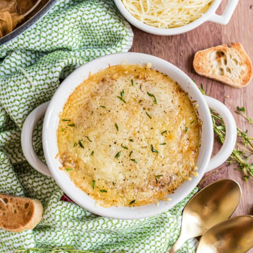 This flavorful, hearty best ever French Onion Soup recipe is a pure bowl of comfort for any night of the week. You'll love the sweet onions, rich broth and toasted cheese on top!