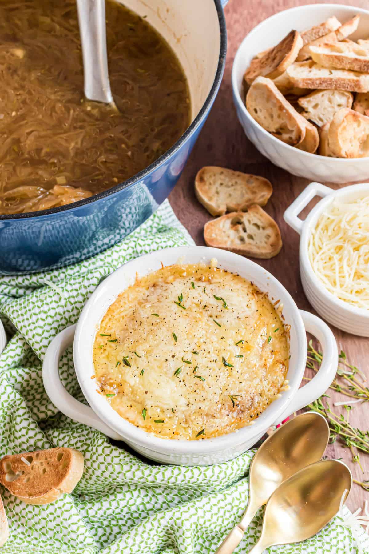 French onion soup served in a white bowl.