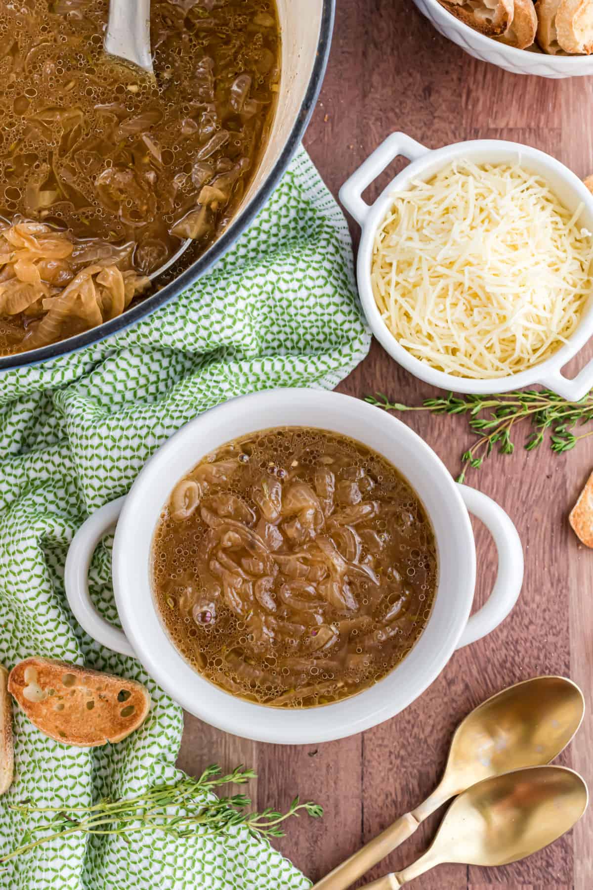 French onion soup ladled into a white bowl.