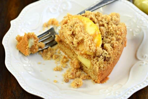 Sweet Cinnamon Apple Crumb Cake with a dense layer of cake, cinnamon apple filling and topped with a crunchy cinnamon streusel! The perfect breakfast!