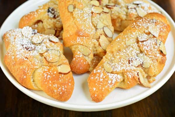 These Easy Almond Croissants are flaky and buttery and packed with a sweet almond filling and topping! You'll love how easy they are to make with crescent rolls, too!