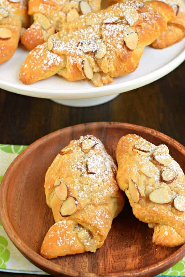 These Easy Almond Croissants are flaky and buttery and packed with a sweet almond filling and topping! You'll love how easy they are to make with crescent rolls, too!