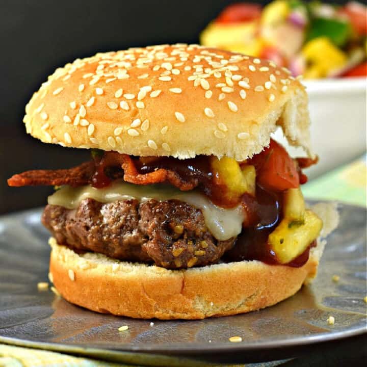 Fruit on a burger? It may not be conventional, but it will blow your mind. Juicy pineapple, tangy BBQ sauce, and a thick slice of bacon meld into a uniquely intense flavor atop my Hawaiian sliders. Ready in 30 minutes, you can prepare this recipe on the stove or outside on the grill. 