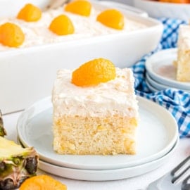Pineapple Orange Cake aka Pig Pickin Cake is the most simple and convenient cake recipe ever. It elevates the classic boxed white cake mix to new heights with bright, citrusy, tropical flavors. 