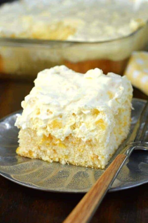 Pineapple Orange Cake is an easy, light dessert recipe that's nearly guilt free! You'll love the refreshing, moist orange cake topped with creamy pineapple flavored frosting!