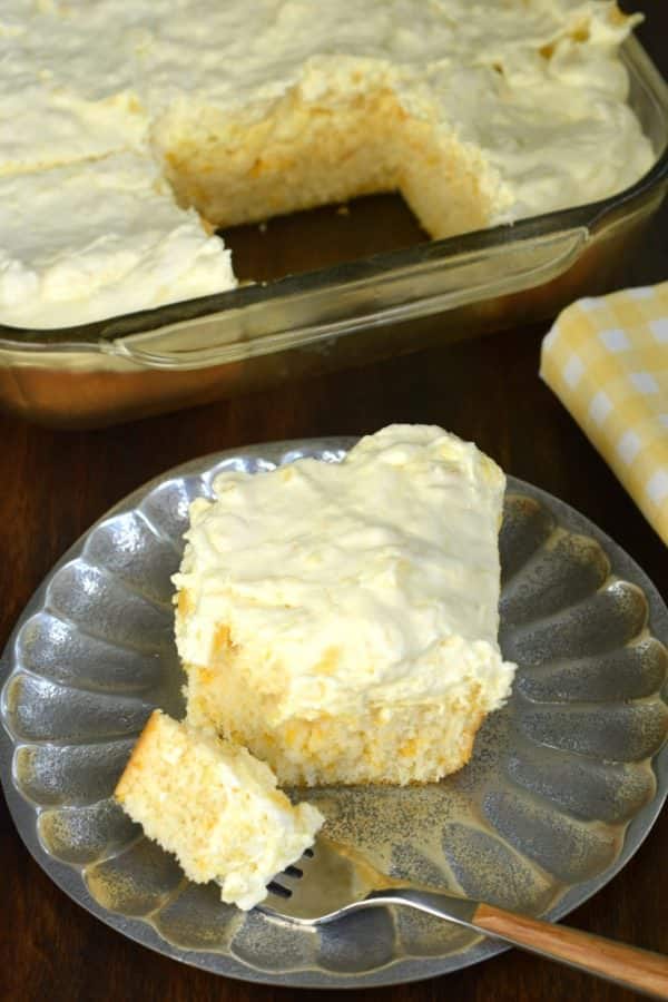 Pineapple Orange Cake is an easy, light dessert recipe that's nearly guilt free! You'll love the refreshing, moist orange cake topped with creamy pineapple flavored frosting!