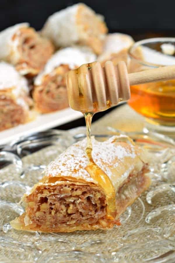 Sweet and flaky, this easy, rolled Russian Baklava will melt in your mouth! Phyllo dough, nuts, and sugar never tasted so good!