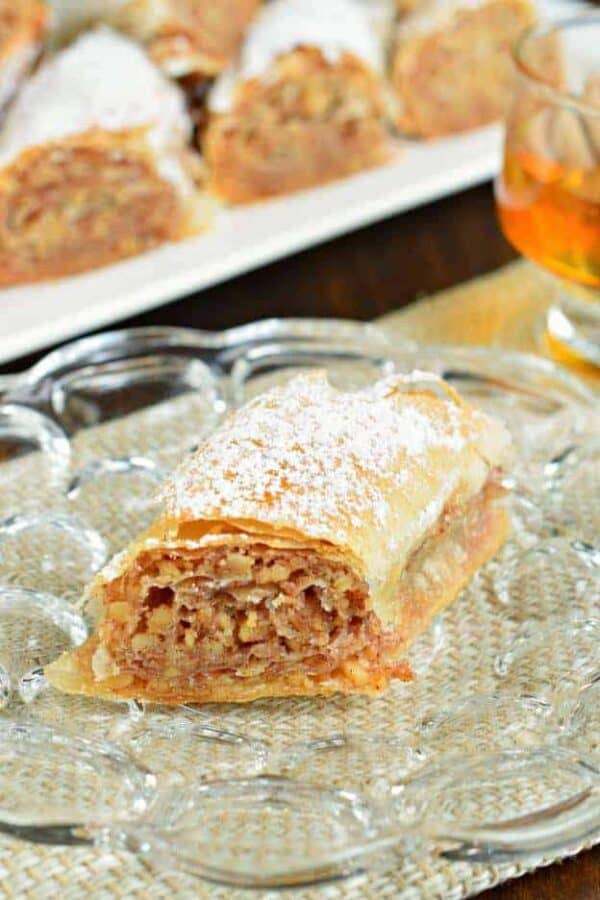 Sweet and flaky, this easy, rolled Russian Baklava will melt in your mouth! Phyllo dough, nuts, and sugar never tasted so good!