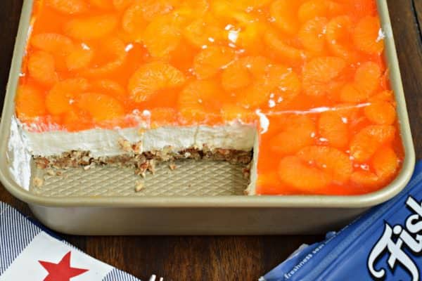 Sweet and salty, this Mandarin Orange Pretzel Bars recipe is the perfect dish to share this summer! You'll love the nutty pecans in the crust of this sweet treat!