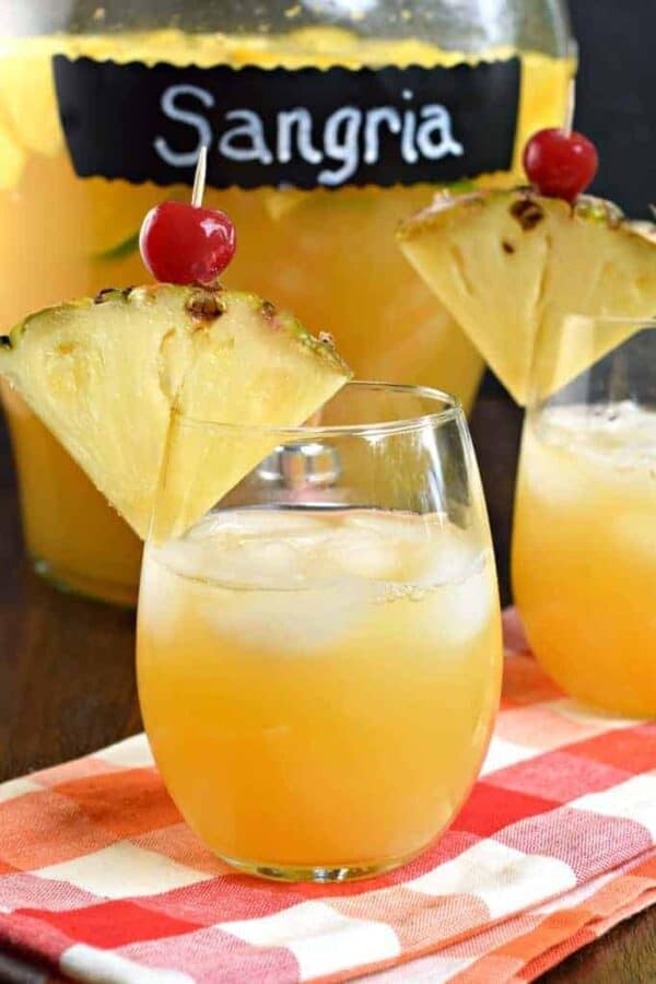 Pineapple Sangria is the perfect, refreshing summer drink! Packed with fruit, juice, and alcohol, you should whip up a batch today!