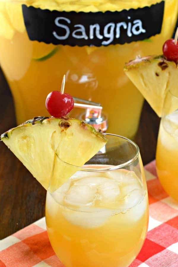 Pineapple Sangria is the perfect, refreshing summer drink! Packed with fruit, juice, and alcohol, you should whip up a batch today!