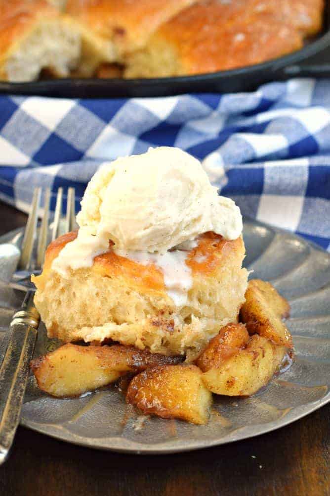 Apple cobbler made in a skillet and topped with vanilla ice cream.
