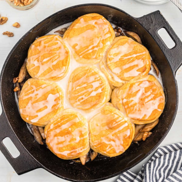 Apples and biscuits baked in a cast iron skillet.