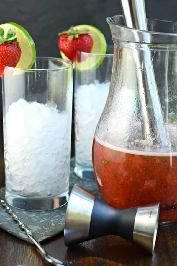 Serve up some Strawberry Mojitos at your next party and get rave reviews! Everyone will love this fruity, minty drink recipe!