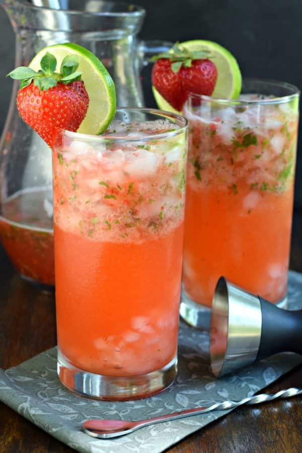 Serve up some Strawberry Mojitos at your next party and get rave reviews! Everyone will love this fruity, minty drink recipe!