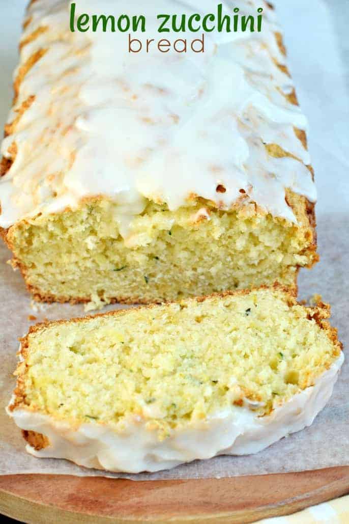 Sliced lemon bread with zucchini and glaze.