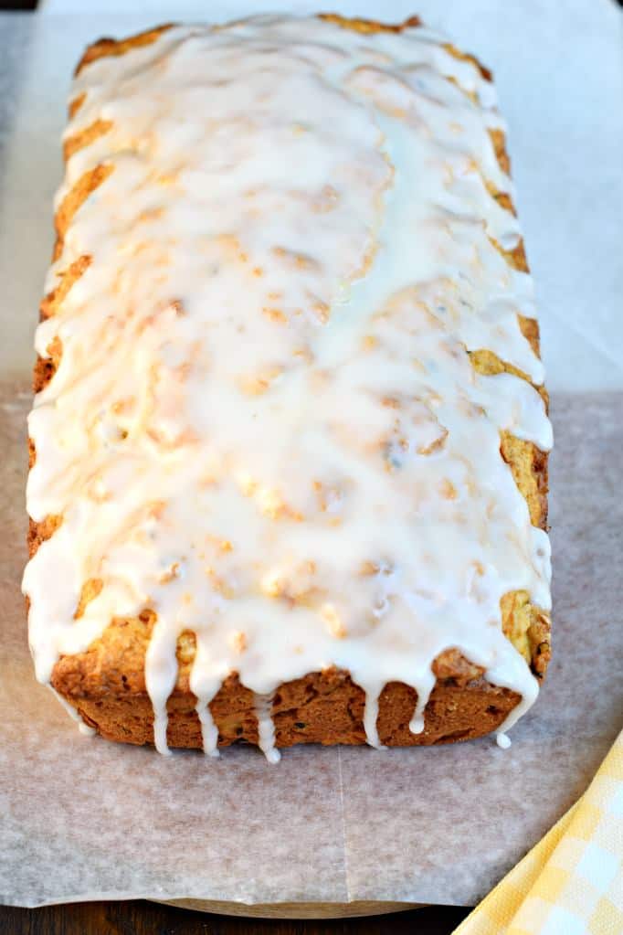 Loaf of zucchini bread with lemon glaze.