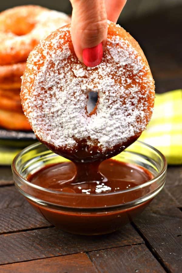 Delicious Apple Ring Fritters start with juicy apples and a buttermilk batter before frying to a golden brown! Then coat them in sugar and serve with your favorite caramel or chocolate dippers!