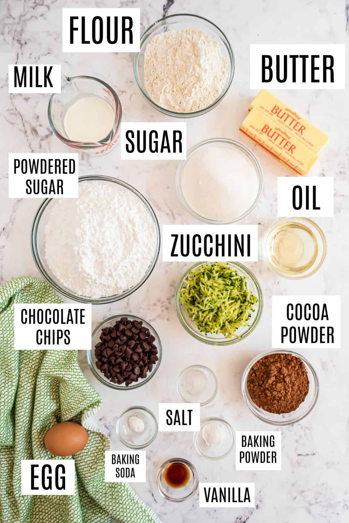 Ingredients needed to make chocolate chip zucchini cupcakes.