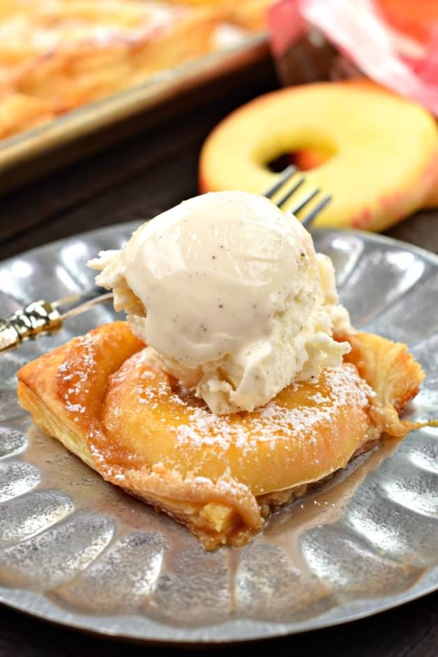 Apple tart slice with ice cream.